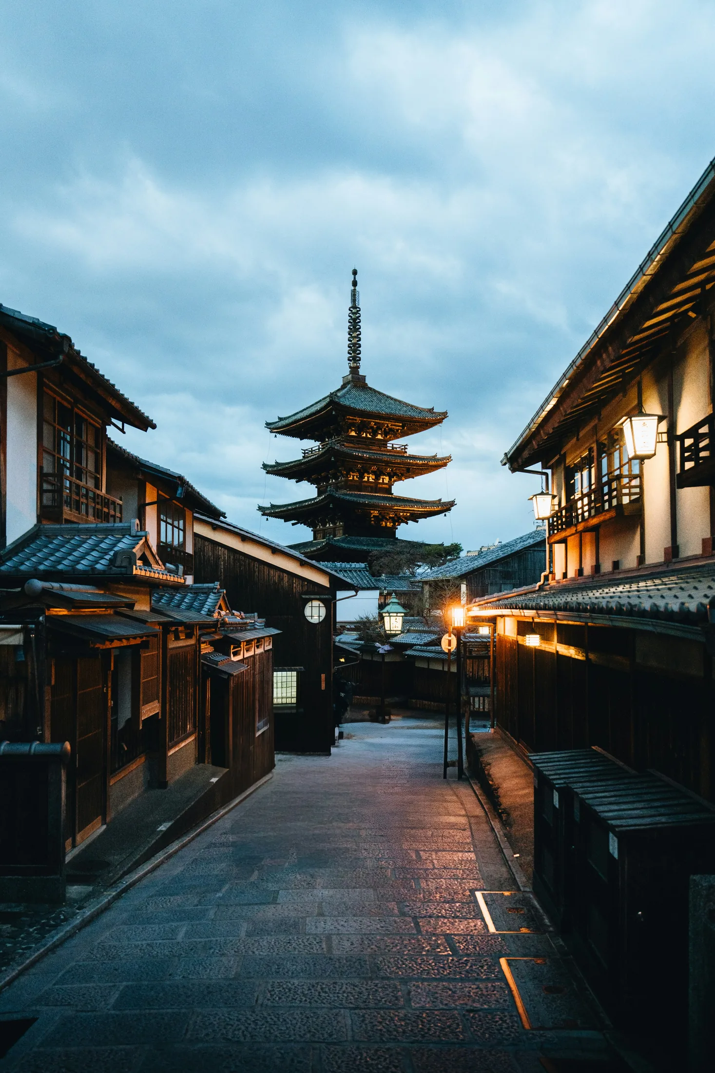 A traditional street and pagoda in Kyoto at dusk